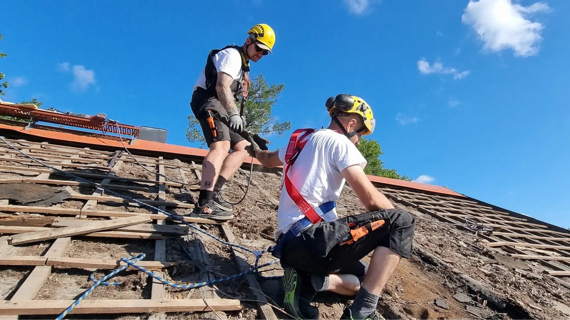Two construction professionals collaborating on site